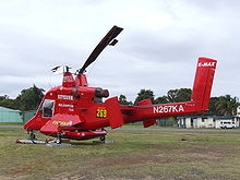 Aircraft Picture - Superior Helicopter Kaman K-Max configured for aerial firefighting, showing the arrangement of the rotors