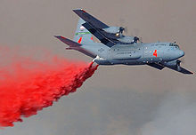 Airplane Picture - A C-130E fitted with a MAFFS dropping fire retardant