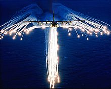 Airplane Picture - A Hercules deploying flares, sometimes referred to as Angel Flares due to the characteristic shape