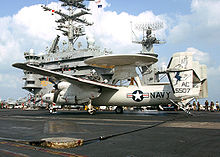 Airplane Picture - Ripples appear along the fuselage of a US Navy E-2C due to loads from landing on the USS Harry S. Truman (CVN-75)