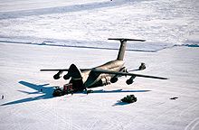 Airplane Picture - Personnel unload cargo from a C-5 Galaxy on an ice runway near McMurdo Station, Antarctica in 1989.