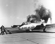 Airplane Picture - Cartridge engine starters in an RB-57B producing copious amounts of black smoke