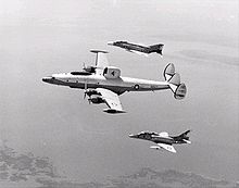 Airplane Picture - VAQ-33 NC-121K in 1973, flanked by an F-4B Phantom II and an EA-4F Skyhawk.