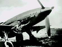 Aircraft Picture - Mechanic Bruno Ferrari posing beside a Re.2005 at Reggio Emilia airfield c. 1944/45.
