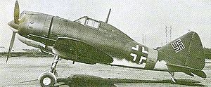 Aircraft Picture - A Reggiane Re 2002 at Taliedo in early 1945, bearing German markings in preparation for delivery to a German Luftwaffe Schlachtgruppe.