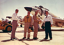 Airplane Picture - F3H Demon delivery. On the right, Wally Schirra shakes hands with Dave Lewis.