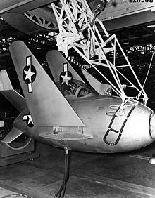 Airplane Picture - Hangar test of recovery trapeze, with wings folded in stowed configuration.