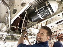Airplane Picture - Installing a refurbished engine fire-bottle onto XH558