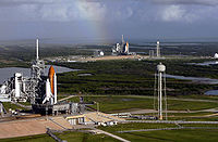 Airplane Picture - Two Space Shuttles sit at launch pads. This particular occasion is due to the final Hubble servicing mission, where the International Space Station is unreachable, which necessitates having a Shuttle on standby for a possible rescue mission.