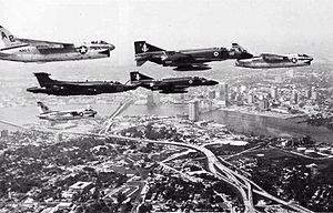 Airplane Picture - A flight of three U.S. Navy Vought A-7E Corsair IIs, two Royal Navy McDonnell Douglas Phantom FG.1 and a Royal Navy Blackburn Buccaneer S.2 over Jacksonville, Florida in 1976. The Phantoms were from No. 892 Naval Air Squadron, and the Buccaneer from No. 809 Naval Air Squadron, of HMS Ark Royal (R09)s air group.