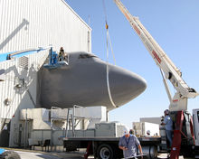 Airplane Picture - Contractors dismantle the Boeing 747 fuselage portion of the System Integration Laboratory at the Birk Flight Test Center.