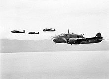 Airplane Picture - Four Australian Beauforts of 100 Squadron near the New Guinea coast in early 1945. Nearest Beaufort is QH-X A9-626.