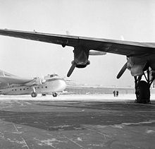 Airplane Picture - A Silver City Airways Bristol Freighter viewed from under the wing of an Avro York at Berlin-Tempelhof, 1954.