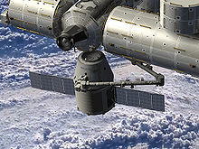 Airplane Picture - Artist rendering of SpaceX Dragon spacecraft delivering cargo to the International Space Station. Credit NASA