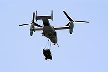 Airplane Picture - A MV-22 Osprey carries an HMMWV vehicle.