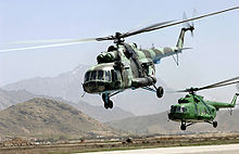 Airplane Picture - Afghan National Air Corps Mi-17s take off in a formation.