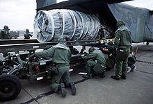 Airplane Picture - A C-23A with an aircraft engine being unloaded.