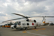 Airplane Picture - A JMSDF SH-60J in Okadama Airport, with a JASDF UH-60J behind it.