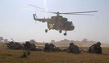 Airplane Picture - US Army's 14th Cavalry Regiment soldiers prepare to rendezvous with Indian Army troops after exiting an Mi-17 helicopter flown by the 107th Indian Army Aviation Helicopter Unit.