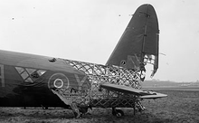 Airplane Picture - Wellington Mark X HE239 of No.428 Sqn. RCAF, illustrating the geodesic construction and the level of punishment it could absorb while maintaining integrity and airworthiness.