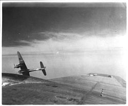 Airplane Picture - An Me 410A-1/U4 with a BK 5 autocannon finishes its attack on a USAAF B-17