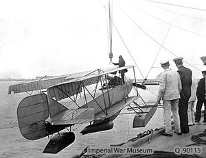 Warbird Picture - Short Folder 81 being hoisted aboard the cruiser HMS Hermes