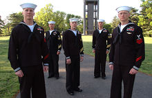 Airplane Picture - Petty Officers wearing service dress uniforms pose for a photograph in front of the Netherlands Carillon at Arlington National Cemetery.