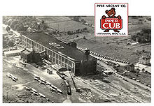 Airplane Picture - Piper Aircraft Company factory in Lock Haven, Pennsylvania, with the Piper Cub logo superimposed at the top.