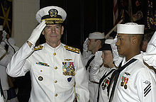 Airplane Picture - A Vice Admiral returns salute from enlisted sailors in dress uniform at a ceremony.