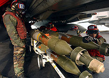 Airplane Picture - Aviation Ordnancemen loading GBU-12 bombs.