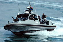 Airplane Picture - Members of Inshore Boat Unit 24 patrol near Kuwait Naval Base.