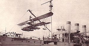 Airplane Picture - A Caudron seaplane, being craned on La Foudre in April 1914