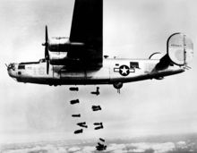 Airplane Picture - A B-24M of the 15th Air Force releases its bombs on the railyards at Mxhldorf, Germany on 19 March 1945