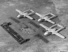 Airplane Picture - Three C-82s and various troops and cargo in 1948