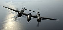 Airplane Picture - The Lockheed P-38 Lightning, a twin-engine fixed-wing aircraft with a twin-boom configuration.