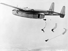 Airplane Picture - Fairchild C-82 Packet dropping paratroops in training exercise