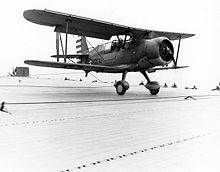 Airplane Picture - SOC-3A Seagull touches down on USS Long Island in April 1942, celebrating the carrier's 2000th landing