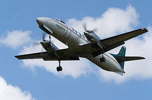 Warbird Picture - Perimeter Aviation C-FUZY SA226-TC Metro II over Winnipeg, Manitoba c. 2007