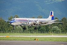 Aircraft Picture - The Red Bull DC-6B landing at Salzburg