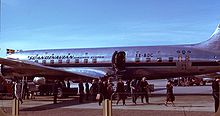 Aircraft Picture - Passengers deplaning an SAS DC-6. Note the upper row of windows, indicating this was built as the optional sleeper variant of the original length DC-6