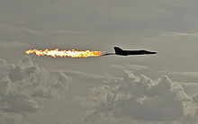 Aircraft Picture - A Royal Australian Air Force F-111C performing a dump-and-burn, a procedure where the fuel is intentionally ignited using the aircraft's afterburner.