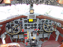 Aircraft Picture - Cockpit of DC-3 operated by FAA to verify operation of navaids (VORs and NDBs) along federal airways