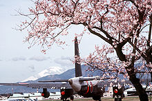 Aircraft Picture - A Japanese P-2J (note the twin-wheel main gear) framed by cherry blossoms at the Naval Air Facility, Atsugi, Japan in 1985