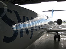 Aircraft Picture - Skywest Airlines Fokker 100 side view, during maintenance at Perth Airport