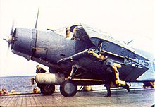 Aircraft Picture - TBD from Torpedo Eight taxiing up the flight deck of Hornet circa 15 May 1942. This aircraft has been equipped with twin .30 in (7.62 mm) machine guns and is carrying a live torpedo.