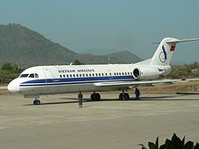 Aircraft Picture - One of Vietnam Airlines's two Fokker 70s on the ground at Luang Prabang International Airport, Laos.