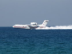 Aircraft Picture - Beriev Be-200 filling water tanks in the Mediterranean Sea while in operation in Mount Carmel forest fire in Israel