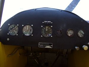 Aircraft Picture - Inside the cockpit of a Piper Cub. The aircraft has far fewer instruments than more modern aircraft.