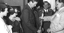Aviation History - Hermann Gxring presents Lindbergh with a medal on behalf of Adolf Hitler; Anne Lindbergh is far left. Photo taken on July 28, 1936.