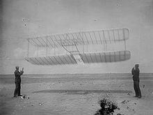 Airplane Picture - Wilbur (left) and Orville flying their 1901 glider as a kite